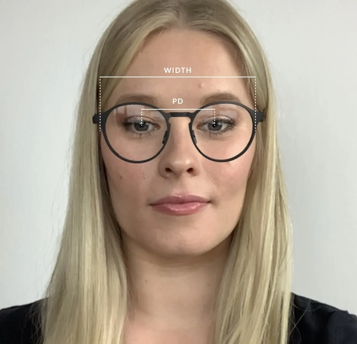Woman with PD and frame width measurement overlay